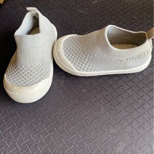 Gray slip on shoes.